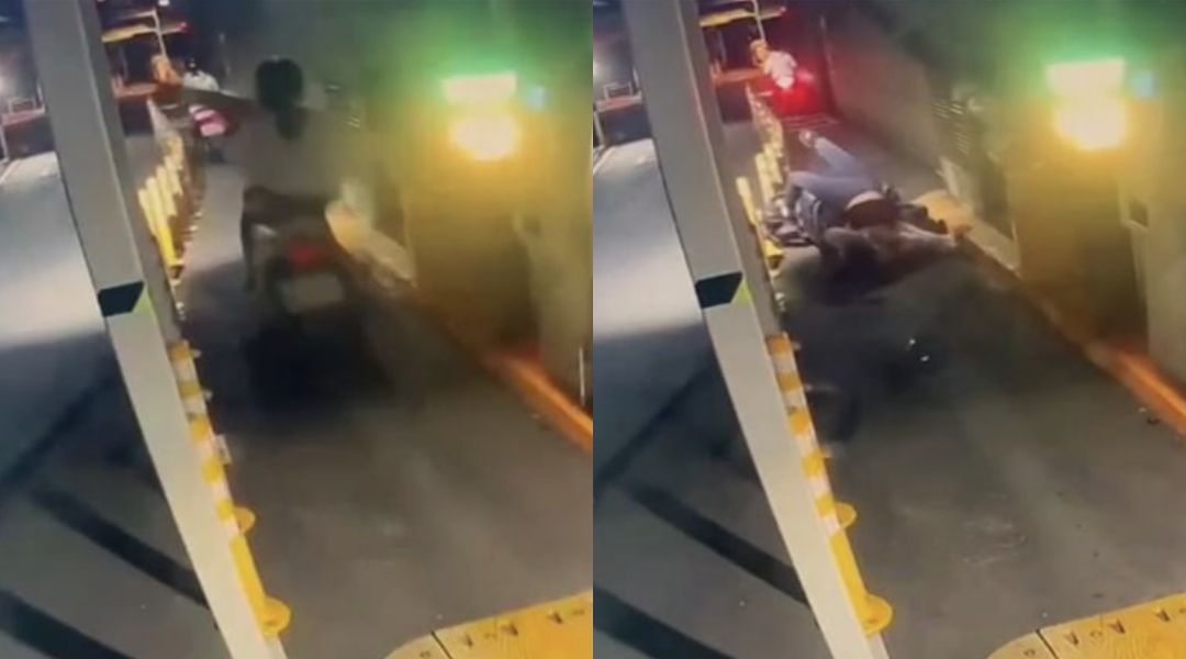 女騎士試圖跟車過閘門,卻遭柵欄擊中摔地。(翻攝自記者爆料網)