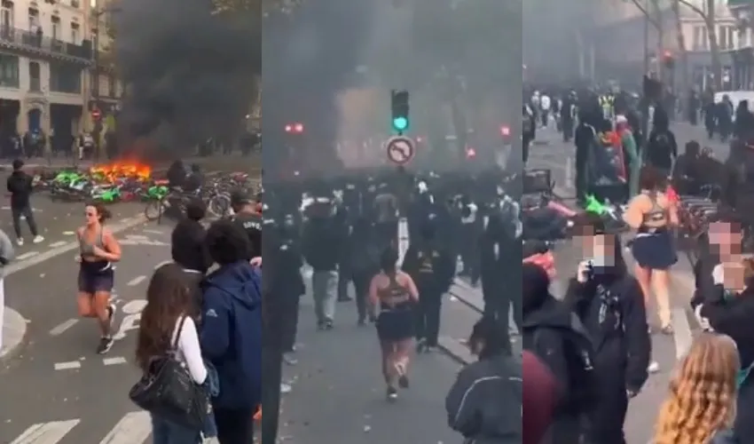 法國示威街頭大火狂燒！她竟「穿越烈火淡定慢跑」　影片爆紅...網笑：國家垮了都不是不健身理由